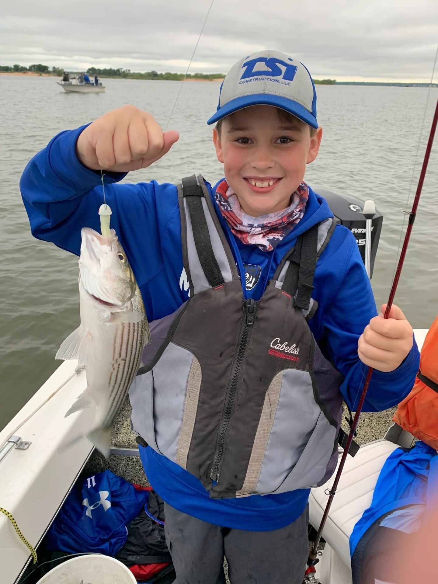 Young angler with a striper